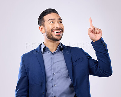 Buy stock photo Asian man, business and pointing hand at space in studio for motivation and advertising. Happy model isolated on gray background as corporate professional and finger for mockup promotion announcement