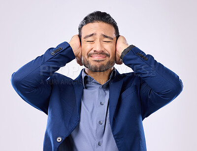 Buy stock photo Employee, noise and Asian man cover ears, stress and mental health against a grey studio background. Japan, male and guy with hands on temples, loud and depression with frustration, audio and sound