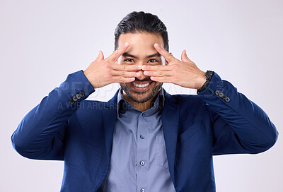 Buy stock photo Asian man, business and hands for eyes and smile in studio for motivation and pride while peeking. Happy male model portrait isolated on a gray background as corporate leader with a positive mindset