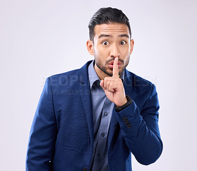 Buy stock photo Portrait, business man and finger on lips in studio, background and privacy secret. Male employee, silence hands and quiet mouth for shush sign, gossip or whisper in silent emoji of corporate mystery