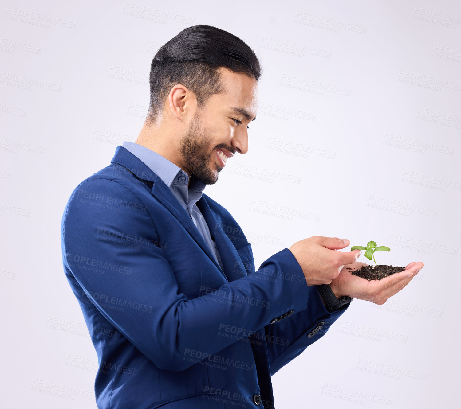 Buy stock photo Happy man with plant in hands isolated on a white background business growth or eco friendly investment. Asian person with sapling soil in palm for sustainable startup and green investing in studio