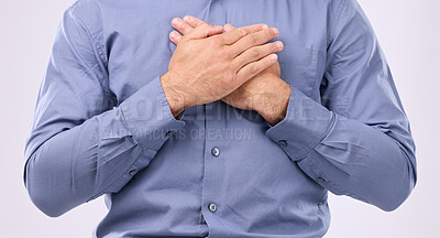 Buy stock photo Closeup, hands on chest and man in studio with self love, hope and love on grey background space. Zoom, hand and open heart gesture by male show emoji, gratitude and calm zen while standing isolated