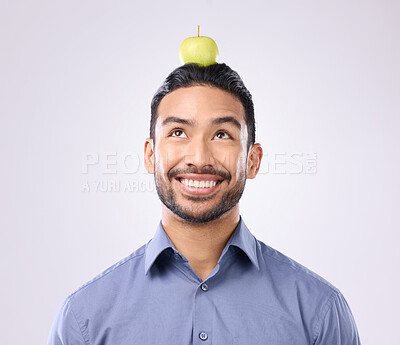 Buy stock photo Apple, head balance and man happy with fruit product for weight loss diet, healthcare lifestyle or body detox. Wellness food, studio nutritionist person and male vegan isolated on gray background