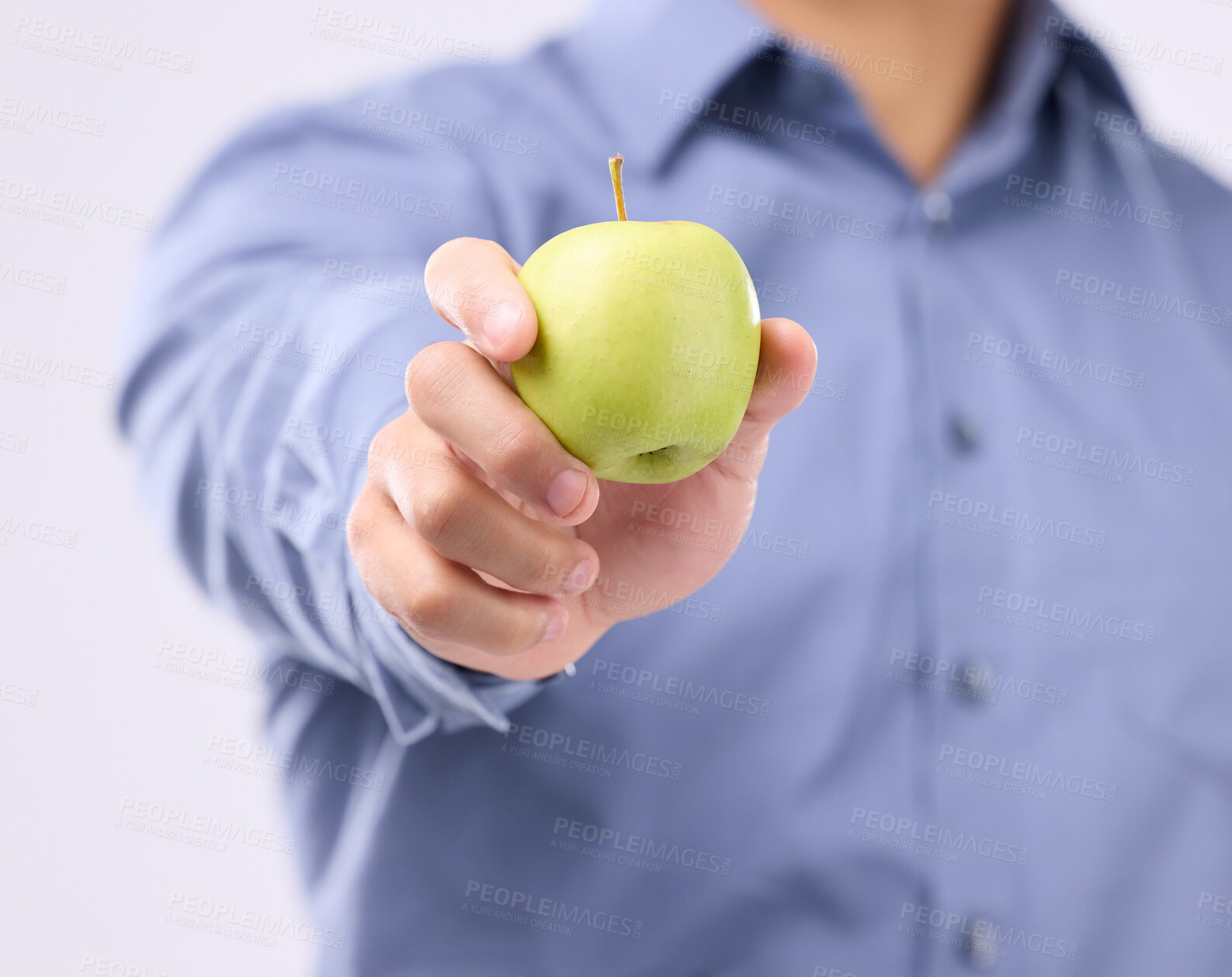 Buy stock photo Apple, studio hands and man with product for weight loss diet, healthcare lifestyle or body detox. Wellness food benefits, nutritionist person and male vegan giving fruit isolated on gray background