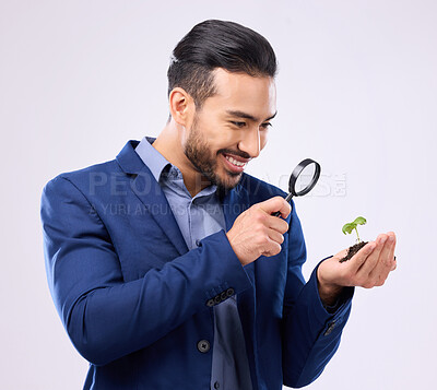 Buy stock photo Man, business growth and plant in studio with magnifying glass for inspection, analysis or happy on white background. Businessman, plants and investment, sustainability or startup company performance