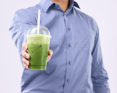 Buy stock photo Smoothie drink in man hands isolated on white background for diet, detox and healthy breakfast offer. Person or nutritionist hand holding or giving green juice for healthy or vegan protein in studio
