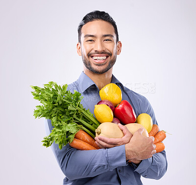 Buy stock photo Healthy, groceries and portrait of an Asian man with vegetables isolated on a white background in a studio. Smile, holding and a Japanese male with food for a diet, vegan lifestyle and nutrition