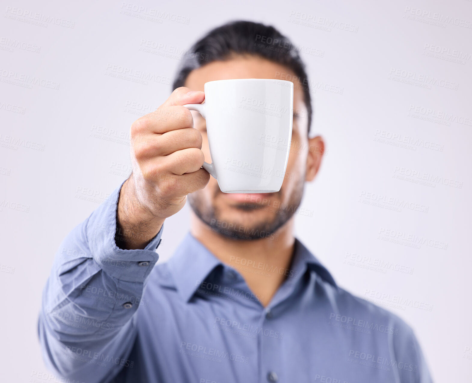 Buy stock photo Hand, coffee cup and studio with business man for drink, energy and health to start morning by background. Businessman, young entrepreneur and holding mug for tea, latte or matcha by gray backdrop