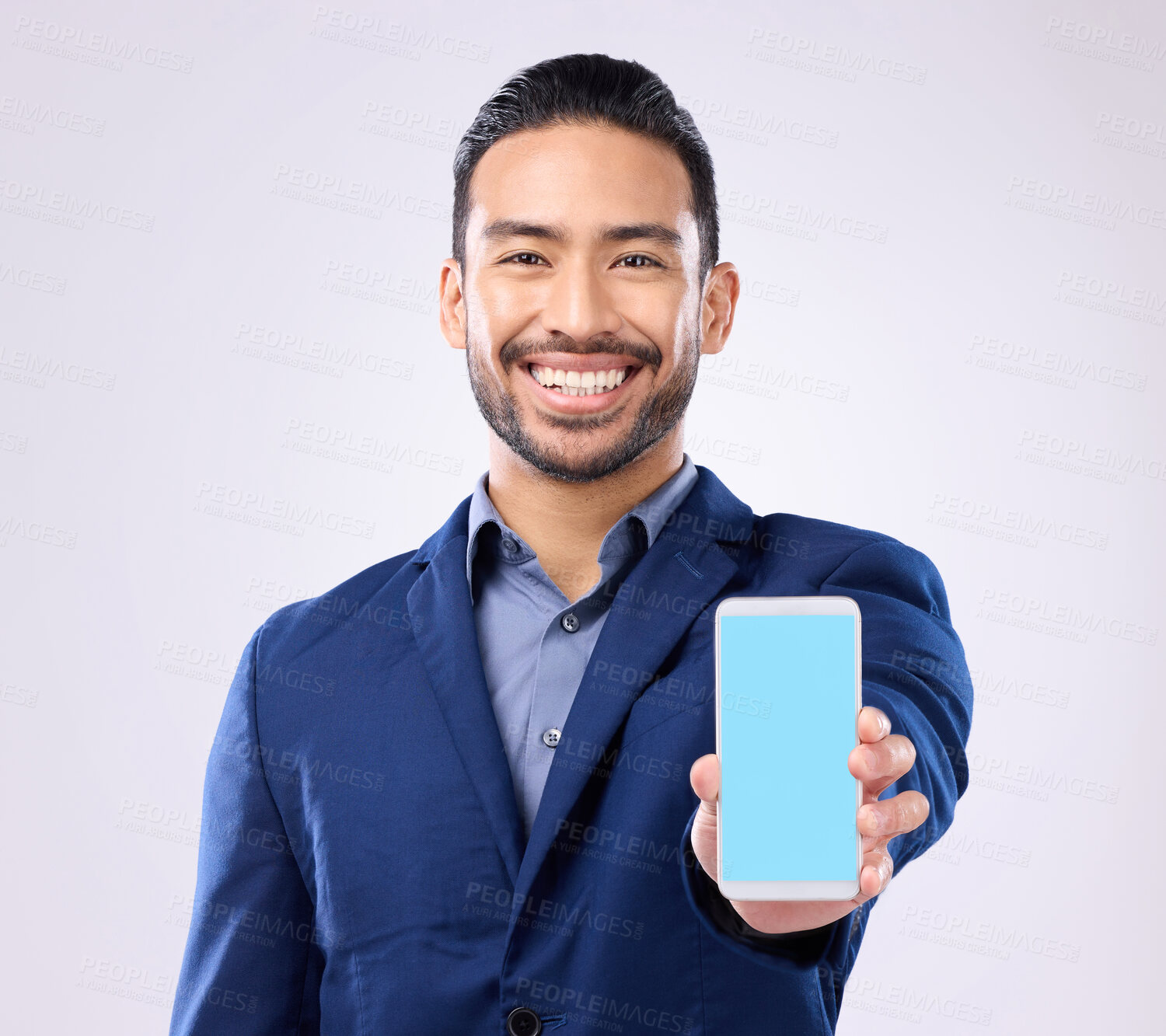 Buy stock photo Portrait, mockup and Asian man with smartphone, green screen and happiness against grey studio background. Face, Japanese male ceo and employee with cellphone, space and social media with connection