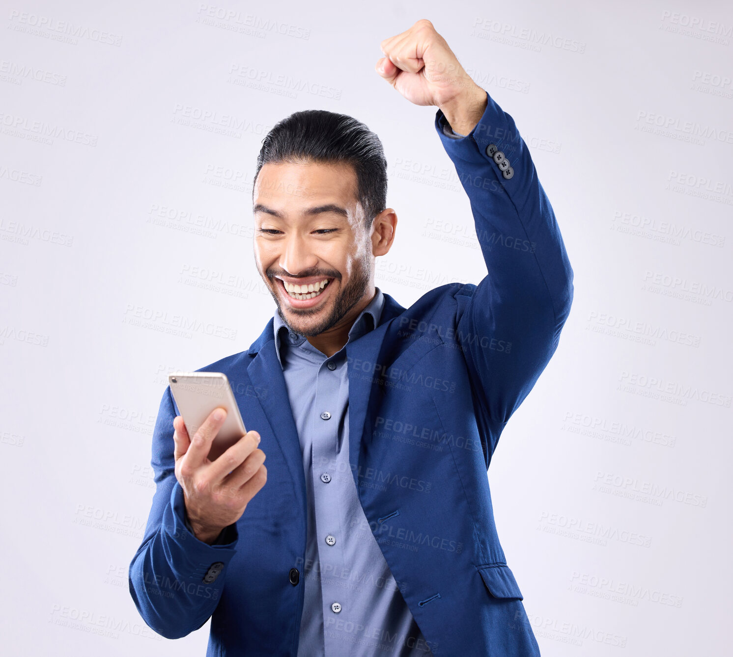 Buy stock photo Happy man, phone and celebrate success in studio for winning, deal or bonus. Business male isolated on gray background with smartphone and fist for mobile app, internet competition or lottery winner 