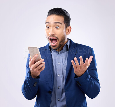 Buy stock photo Business man, phone and wow for success in studio for winning, deal or bonus notification. Excited male model isolated on gray background with smartphone mobile app, internet competition or surprise