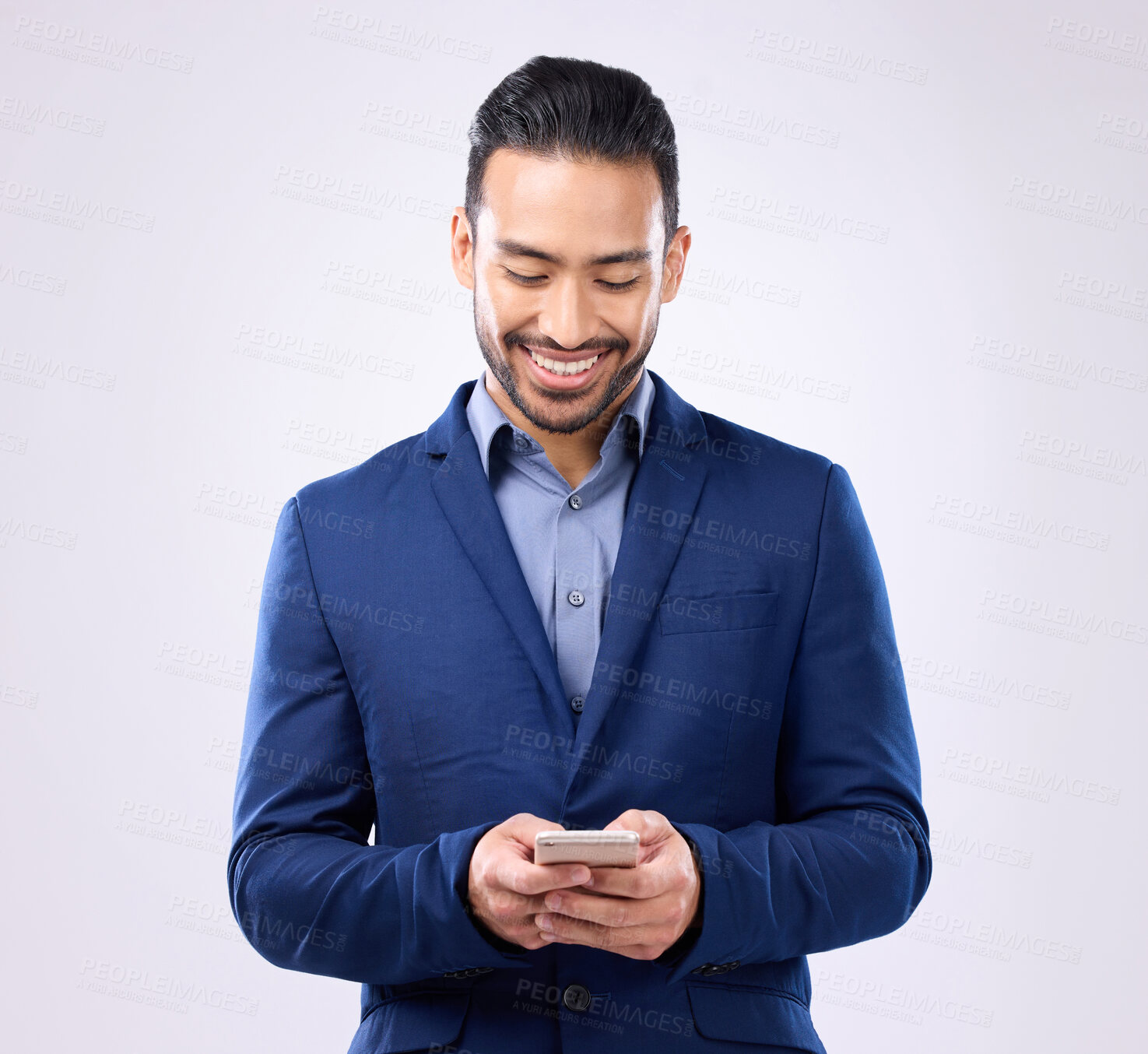 Buy stock photo Asian man, business and phone in studio for communication and network connection. Happy male model isolated on a gray background with smartphone for mobile app, online chat and typing on internet