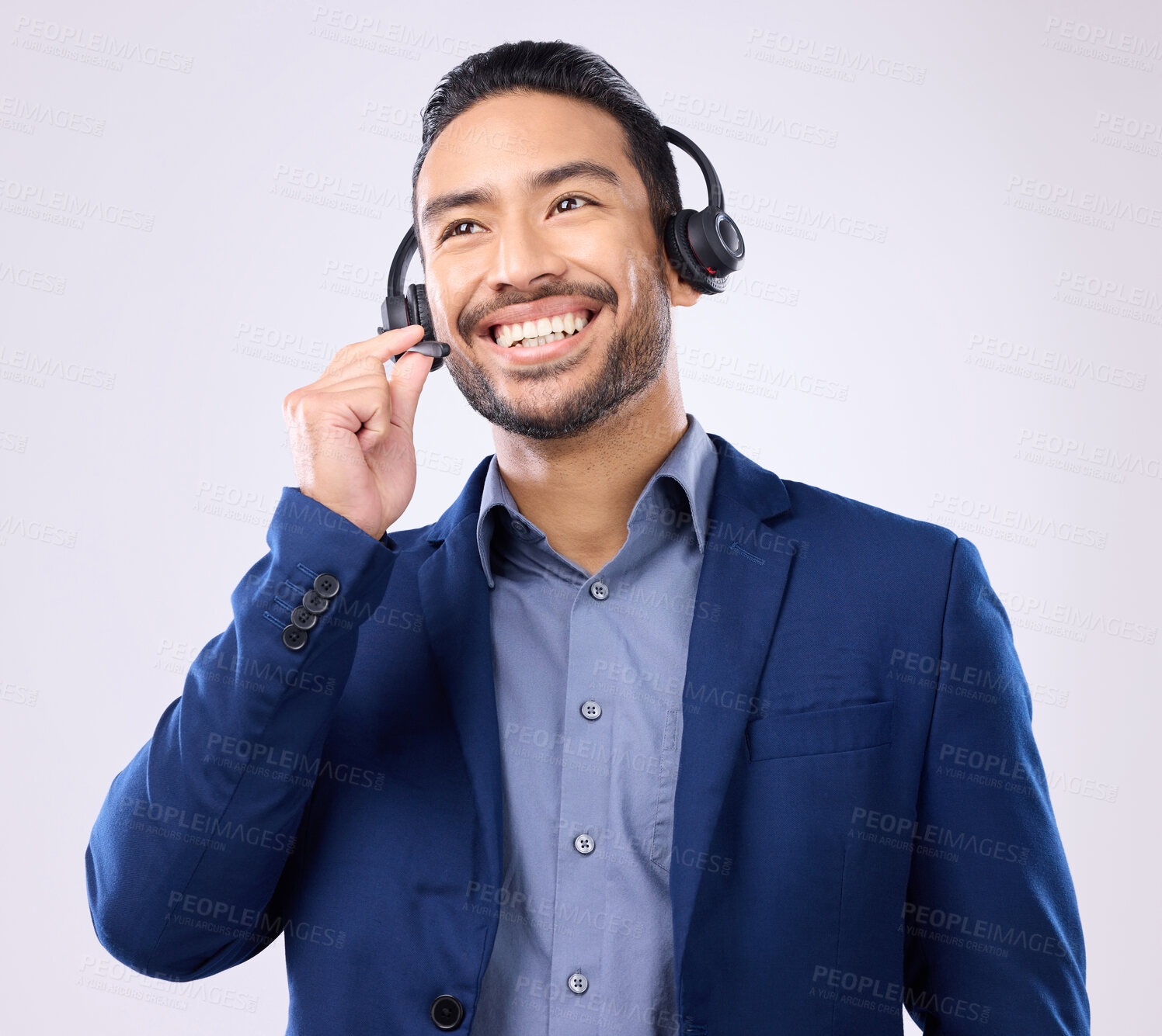 Buy stock photo Thinking, customer service and smile with a man consulting using a headset for support in studio on a gray background. Idea, contact us and crm with a happy male consultant talking over a microphone