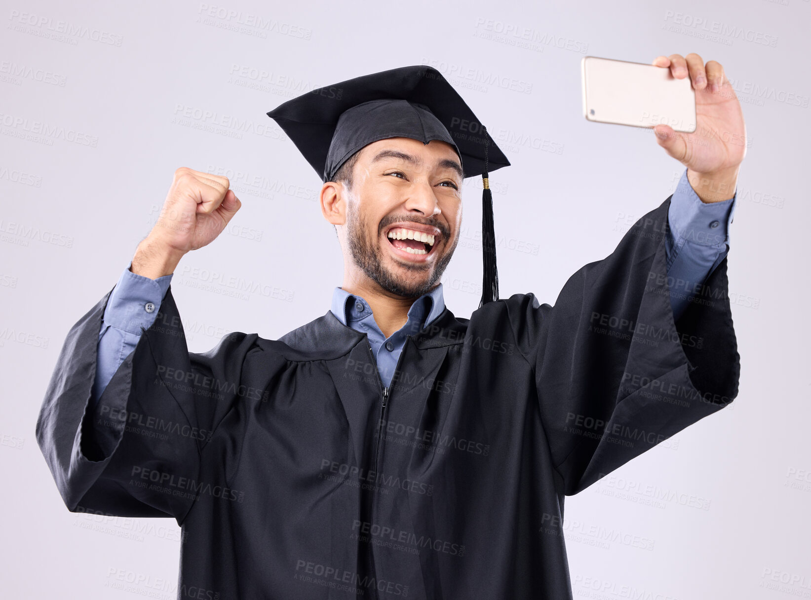 Buy stock photo Man, graduate and selfie with smile for scholarship, profile picture or social media against a gray studio background. Happy excited male academic smiling for graduation photo, memory or online post