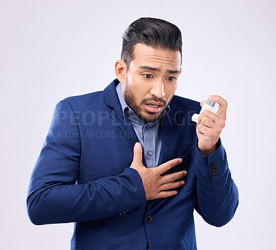 Buy stock photo Asthma pump, business man and breathe in studio, medical health and worried of cough in chest pain. Sick male worker breathing medicine inhaler for lungs, oxygen and panic attack of allergy emergency