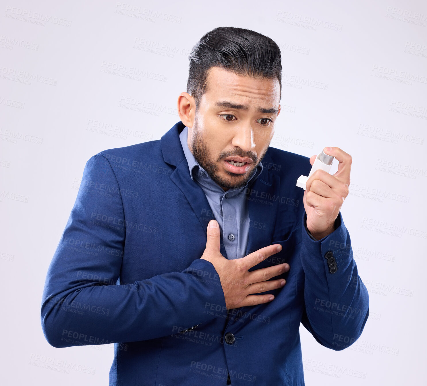 Buy stock photo Asthma pump, business man and breathe in studio, medical health and worried of cough in chest pain. Sick male worker breathing medicine inhaler for lungs, oxygen and panic attack of allergy emergency