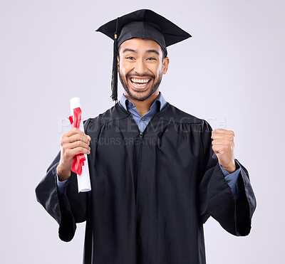 Buy stock photo Graduation portrait of asian man, certificate and success isolated on studio background for university achievement. Fist pump of happy student, person or college graduate and diploma, award and goals