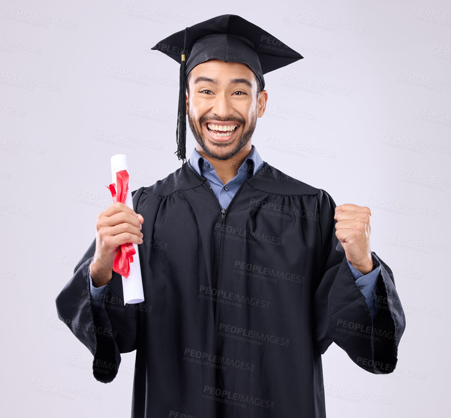 Buy stock photo Graduation portrait of asian man, certificate and success isolated on studio background for university achievement. Fist pump of happy student, person or college graduate and diploma, award and goals