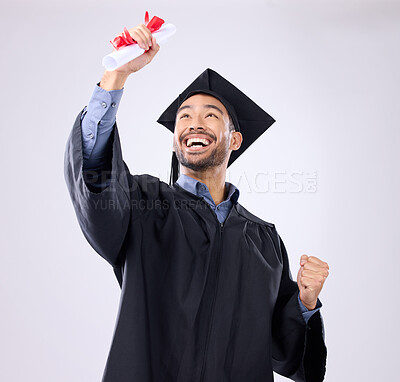 Buy stock photo Student man, celebration and diploma in studio with happiness, success and achievement of life goals. Asian guy, happy and certificate for graduation from college, university or academy with smile