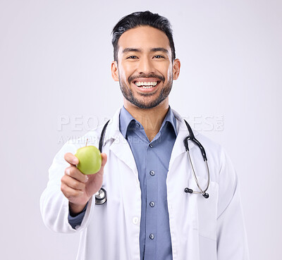 Buy stock photo Apple, doctor portrait and man happy with fruit recommendation for weight loss diet, medical healthcare or detox. Wellness, nutritionist nurse and male vegan giving food isolated on gray background