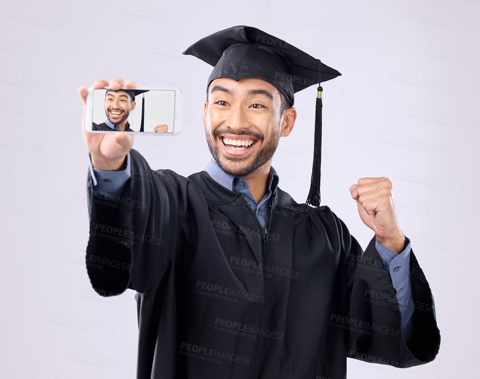 Buy stock photo Asian man, selfie and smile for graduation, scholarship or diploma against a white studio background. Happy male graduate smiling for profile picture, vlog or photo in memory of milestone achievement