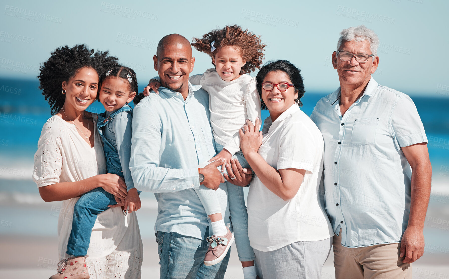 Buy stock photo Big family, smile and portrait at beach on vacation, bonding and care at seashore. Holiday relax, summer ocean and happy father, mother and grandparents, girls or kids enjoying quality time together.