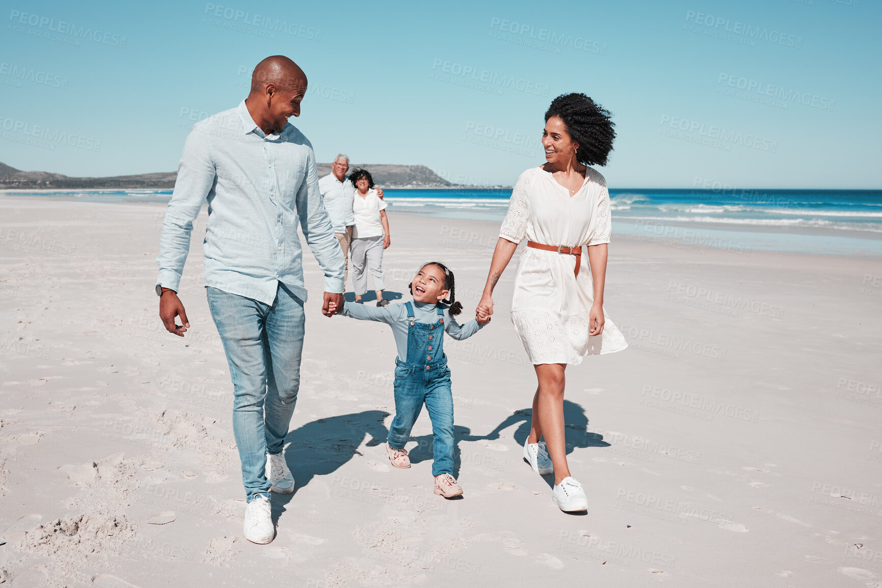 Buy stock photo Love, beach and family holding hands while walking together on a summer vacation, adventure or weekend trip. Happy, activity and parents with their child by the ocean on a tropical holiday in Mexico.