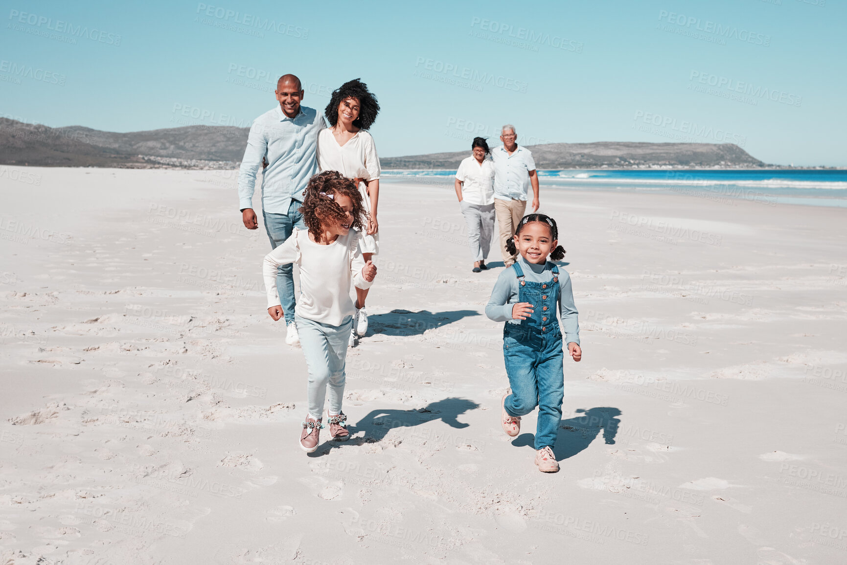 Buy stock photo Mother, father and children play on beach to relax on summer holiday, vacation and weekend. Happy family, grandparents and mom, dad and girls running for freedom, adventure and quality time by ocean