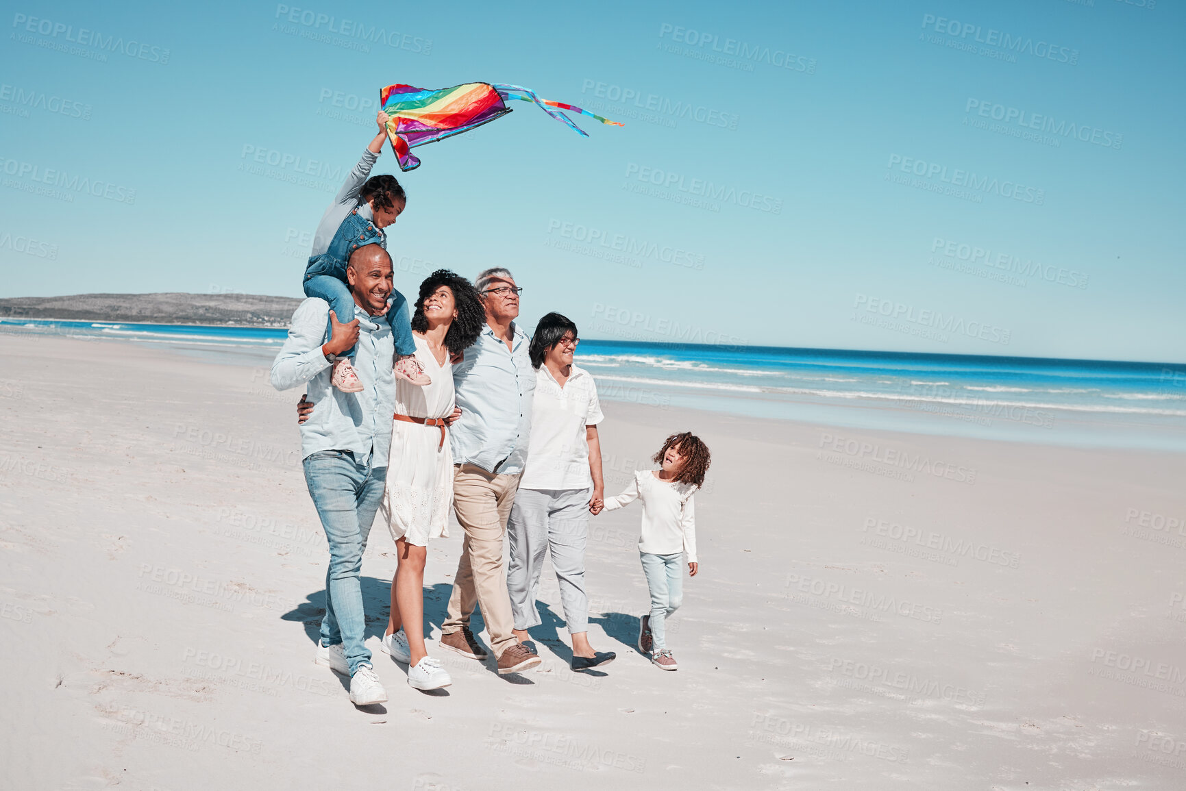 Buy stock photo Relax, holding hands and kite with big family on beach for vacation, summer break and playful. Bonding, support and grandparents with children and parents for holiday, affectionate and generations