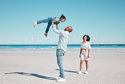 Buy stock photo Playing, happy and child with parents at the beach for bonding, quality time and relaxation.  Smile, family and playful girl kid with dad and mother at the ocean for holiday, happiness and summer