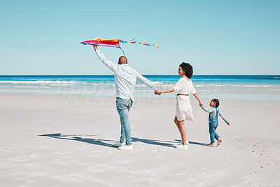 Buy stock photo Holding hands, kite and family walking together at a beach, relax and bonding on ocean background. Flying, toy and couple with daughter at the sea, walk and enjoy a trip in Miami with fun games