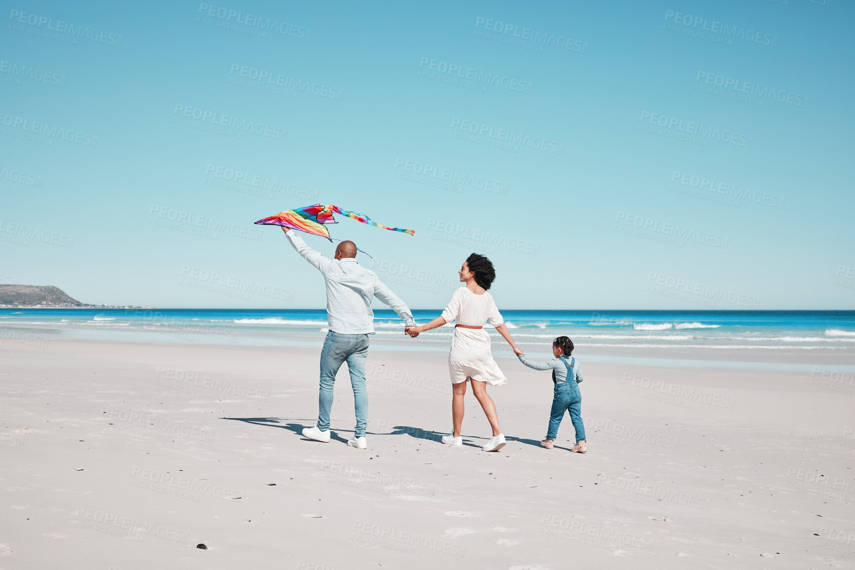 Buy stock photo Holding hands, travel and family walking with kite together at a beach, relax and bond on ocean background. Flying, toy and couple with daughter at the sea, walk and enjoy trip in Miami with fun game