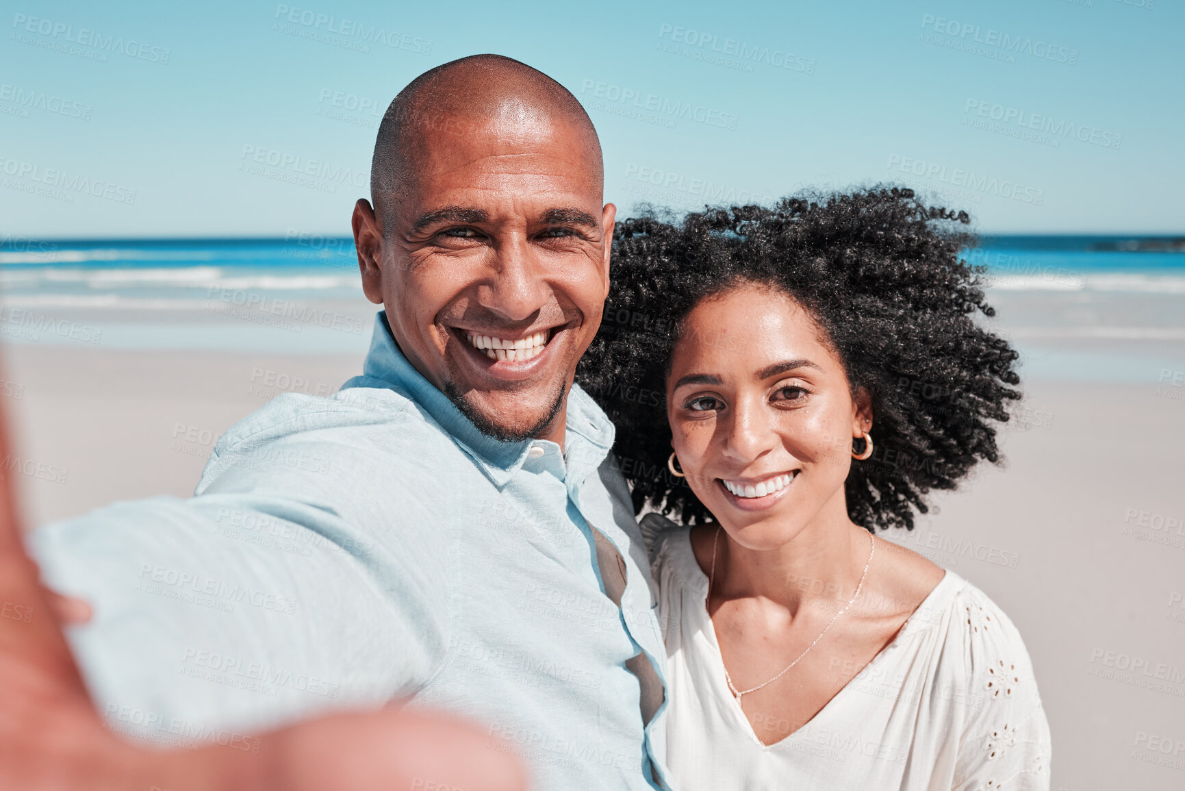 Buy stock photo Couple, smile and selfie portrait at beach on vacation, bonding and care at seashore. Holiday love, summer ocean and man and woman taking pictures for social media, profile picture or happy memory.