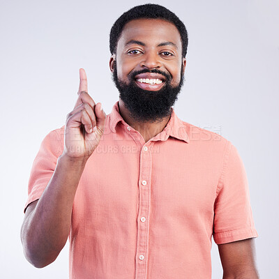 Buy stock photo Black man, studio portrait and point finger for answer, question and smile with confidence by background. Young model, african student and hand gesture with happiness on face for fashion by backdrop