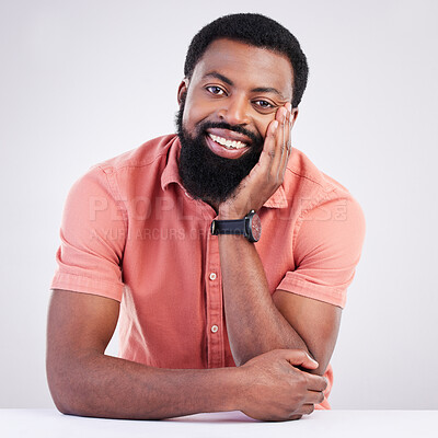 Buy stock photo Happy, handsome and portrait of a black man leaning on a table isolated on a white background. Smile, relax and an African guy looking relaxed, calm and at peace with confidence on a studio backdrop