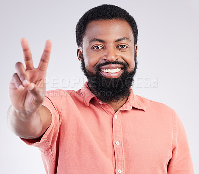 Buy stock photo Black man, hand and peace sign in studio portrait with smile, emoji or happiness by background. Young african model, signal or zen symbol for opinion, mindset or voice for confident pride by backdrop