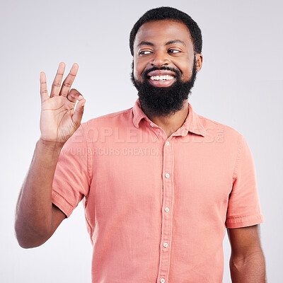 Buy stock photo Perfect, happy and okay sign with black man in studio for deal, success and good news. Thank you, agreement and emoji with male isolated on gray background for celebration, opinion and confidence