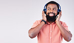 Black man, studio mockup space and headphones for music to relax, listen and streaming by background. Happy african model, audio and sound for peace, mindfulness and online podcast with smile on face