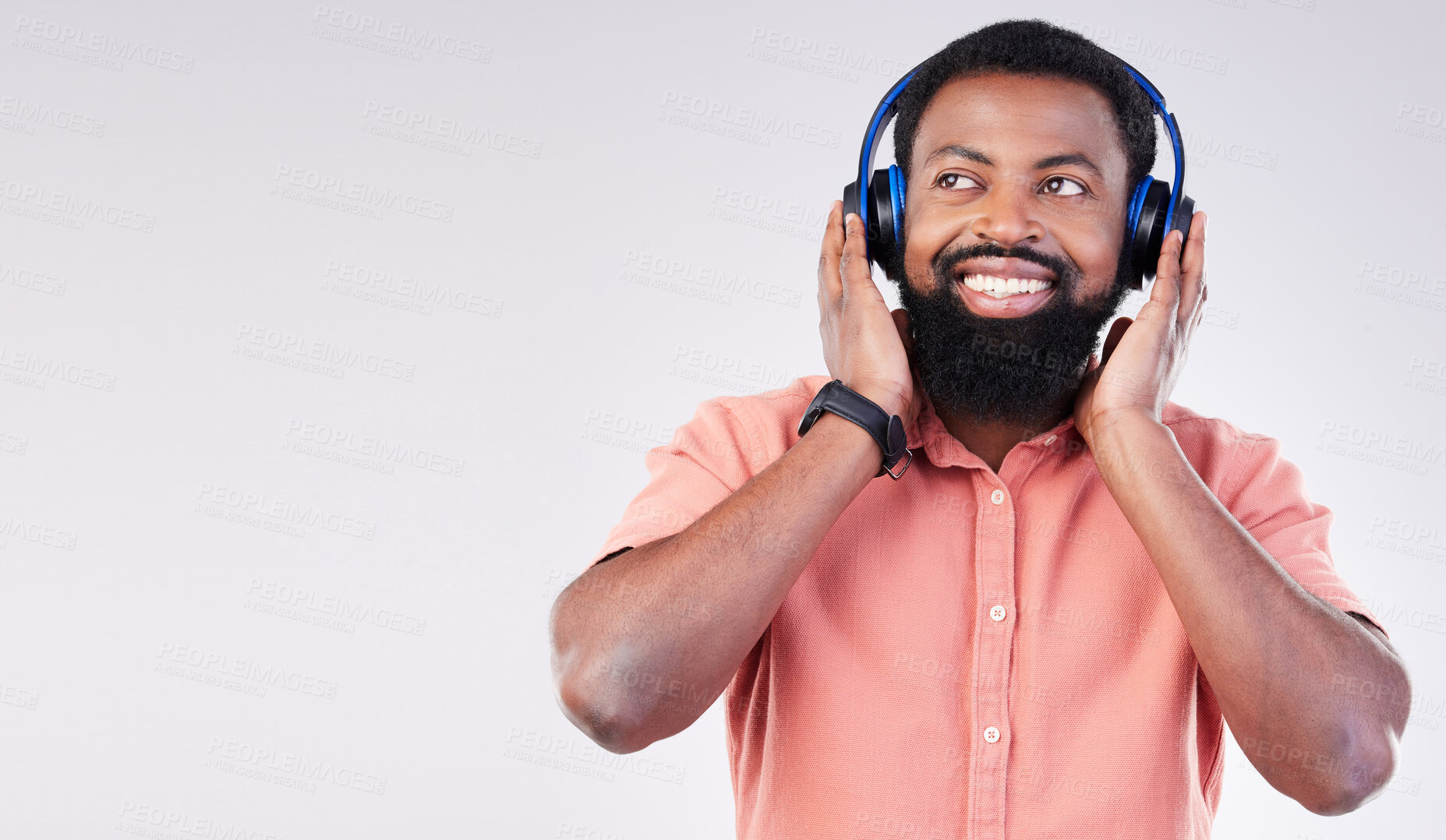 Buy stock photo Black man, studio mockup space and headphones for music to relax, listen and streaming by background. Happy african model, audio and sound for peace, mindfulness and online podcast with smile on face