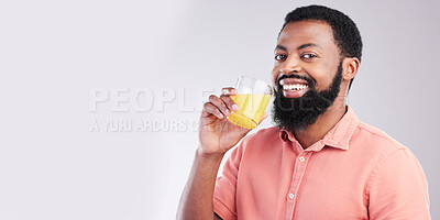Buy stock photo Orange juice, portrait and happy black man drinking with glass for hydration, liquid detox or weight loss. Vitamin C benefits, male nutritionist beverage and studio person on mockup gray background