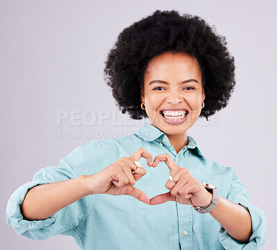Buy stock photo Black woman, studio portrait and heart hands with afro, smile and romance icon with love, confidence and face. Happy african, model and emoji for happiness, date and romantic sign by gray background