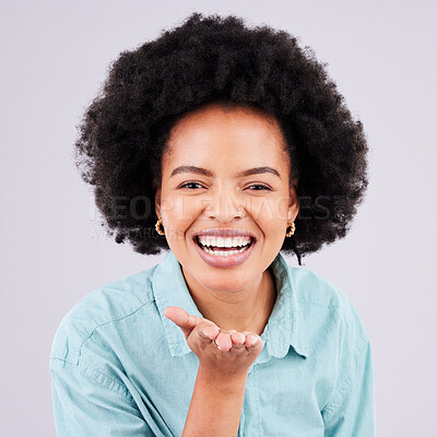 Buy stock photo Happy, laughing and portrait of a black woman blowing kiss isolated on a white background in a studio. Laugh, smile and cheerful and beautiful African girl with a gesture for love, care and flirty