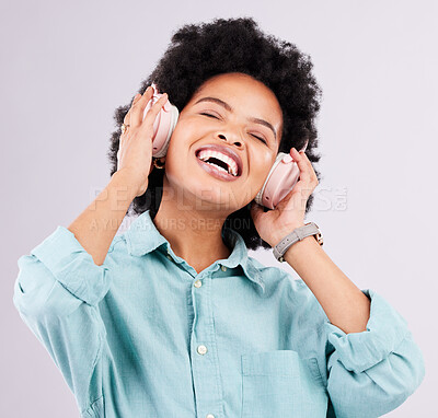 Buy stock photo Music headphones, dance and happy black woman streaming song for studio fun, freedom and wellness. Dancing energy, audio podcast and person listening to radio, media sound or track on gray background