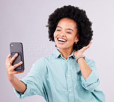 Buy stock photo Black woman, selfie and afro with smile in studio with technology, social media and funny by gray background. Girl, model and influencer with profile picture, photography and blog post with happiness