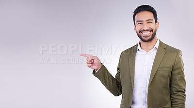 Buy stock photo Happy businessman, pointing and mockup for product placement, marketing or advertising against a white studio background. Employee man with smile showing point of advertisement, news or notification