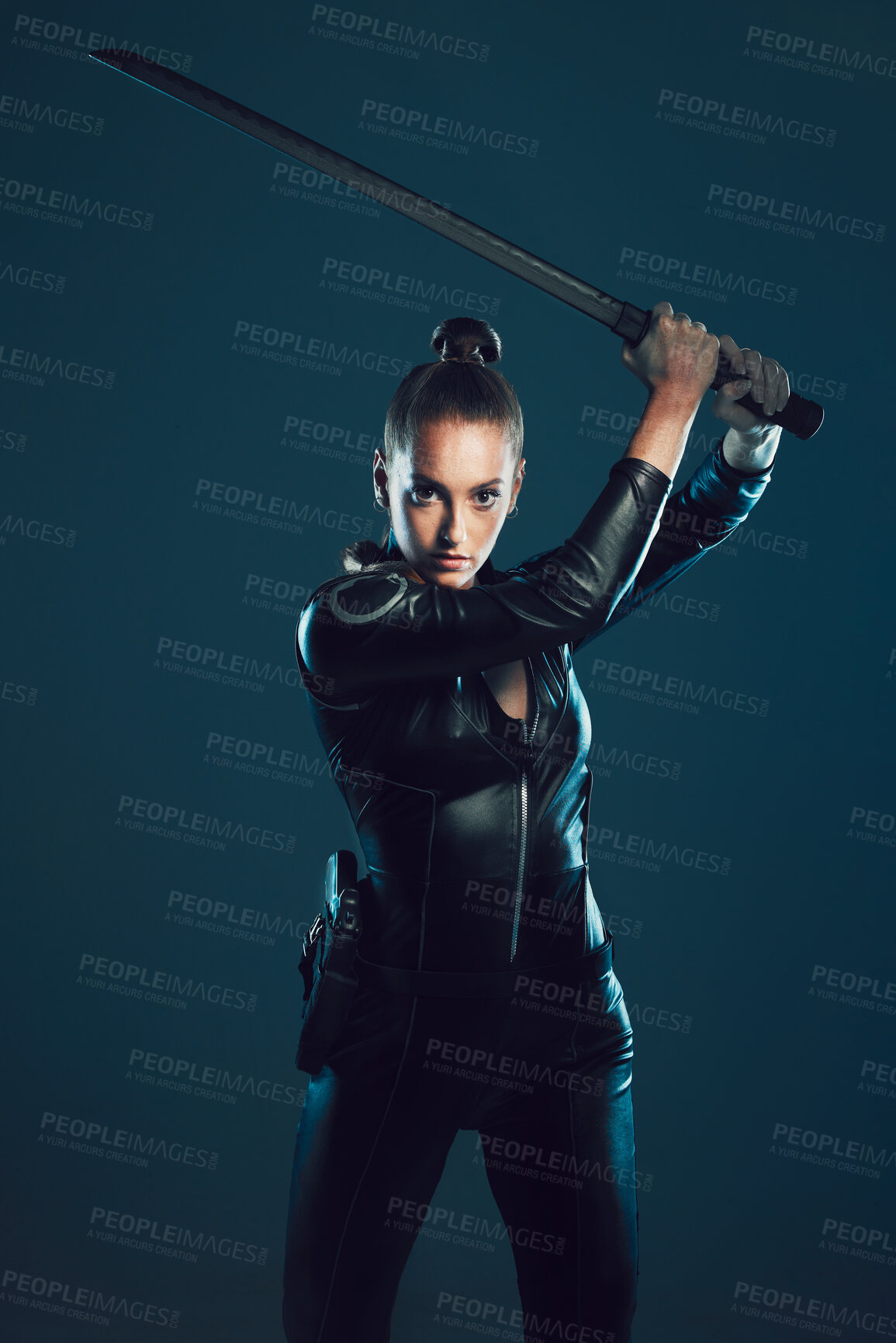 Buy stock photo Woman, warrior and vigilante in cosplay with sword ready for battle, war or game against a dark studio background. Female in black costume or hero with guns and blade for halloween or super power
