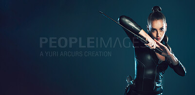 Buy stock photo Woman, warrior and vigilante in cosplay with sword on mockup for battle, war or game against dark studio background. Portrait of female in black hero costume with blade for superhero halloween outfit