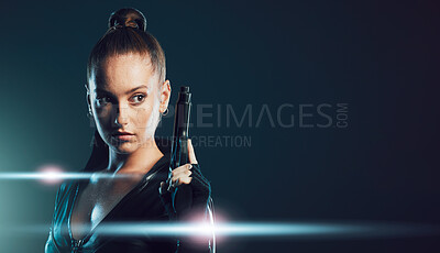 Buy stock photo Woman, gun and assassin costume in studio with mock up space for action, movie promo and branding. Girl, pistol and mockup for logo, brand and promotion with model ninja, danger and future aesthetic
