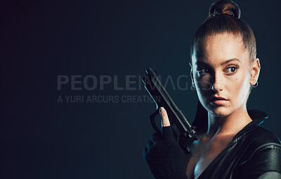 Buy stock photo Woman, vigilante and gun in serious war, battle or agent standing ready for mission on mockup. Female spy holding weapon for secret operation, objective or cosplay against a dark studio background