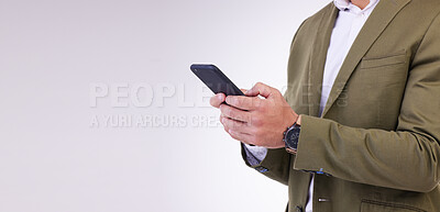 Buy stock photo Businessman, hands and phone typing on mockup for social media or communication against a white studio background. Hand of isolated employee man texting, chatting or browsing on mobile smartphone app